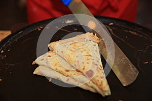 Cooking French Crepe on Street Market