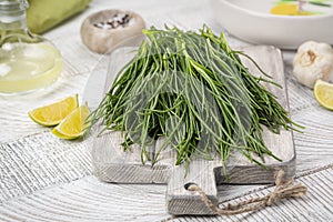 Cooking Fresh Agretti or barba dei frati, edible green plant. Saltwort photo