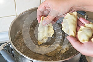 Cooking fresh dumplings with cherry filling