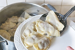 Cooking fresh dumplings with cherry filling