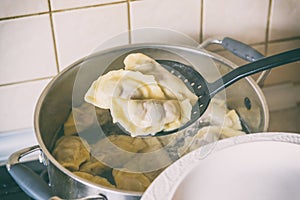 Cooking fresh dumplings with cherry filling