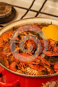 Cooking freshwater crayfish in a pan. Crayfish boil in boiling water, close-up. Cooking crayfish in boiling water