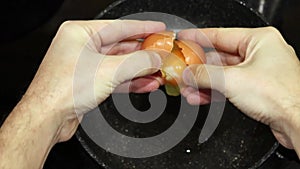 cooking fried eggs for breakfast in to pan