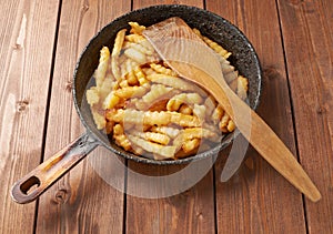 Cooking fried french potatoes composition