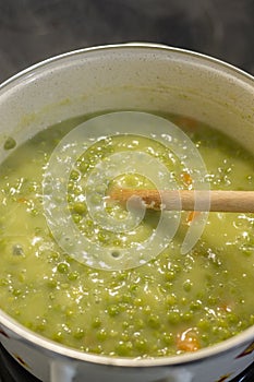 Cooking Green Peas in the pot on the stove