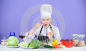 Cooking healthy food. Fresh vegetables ingredients for cooking meal. Professional cooking tips. Woman chef try taste