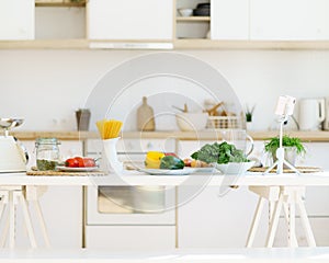 Healthy food for cooking italian pasta and vegetables on kitchen table in modern light apartment