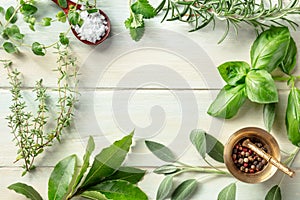 Cooking with herbs flat lay frame with copy space, salt, and pepper