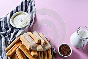 Cooking Italian Dessert with cocoa, coffee and mascarpone cheese Tiramisu and all the necessary food ingredients and utensils.