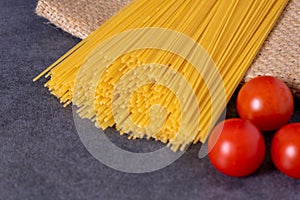 Cooking Italian pasta with tomatoes concept.