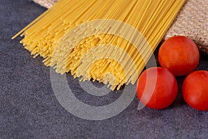 Cooking Italian pasta with tomatoes concept.