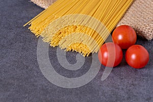 Cooking Italian pasta with tomatoes concept.