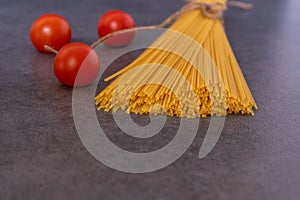 Cooking Italian pasta with tomatoes concept.