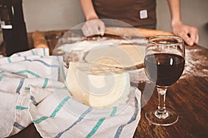 Khachapuri with cheese is molded on the table