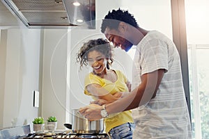 Cooking, love and food with couple in kitchen for bonding, breakfast and morning. Happiness, smile and health with man