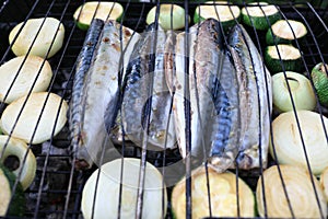 Cooking mackerel on grill