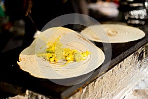 Cooking masala dosa at Surajkund Mela food stall