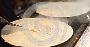 Cooking masala dosa at Surajkund Mela food stall