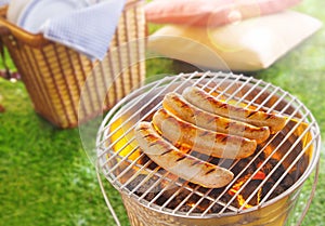 Cooking the meat, bratwurst, at a summer bbq