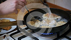 Cooking Meat Chops in a Frying Pan in the Home Kitchen. Slow Motion