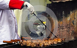 Cooking meat on coals, hot fish, chicken and pork barbecue, fresh hot juicy grill. Street food of Asian peoples
