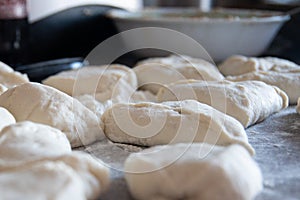 Cooking meat pies from dough using flour. Side view. Traditional Russian cuisine