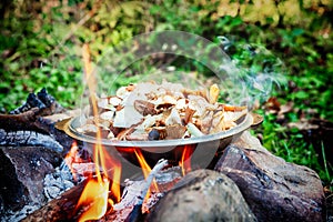 Cooking mushrooms on an open fire
