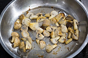 Cooking mushrooms in a pan.