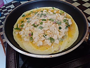 cooking an omelet in a frying pan