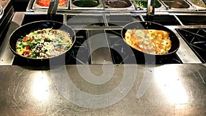 Cooking omelettes and fried eggs. Breakfast buffet in restaurant