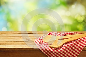 Cooking outdoor background with wooden spoons