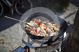 Cooking outdoors on a camping kitchen