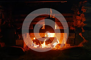 Cooking over the open fire at the Gouland Downs DoC hut on the Heaphy Track