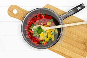 Cooking pan with colorful paprikas