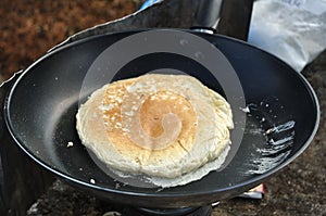 Cooking a Pancake at a Campsite