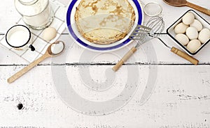 Cooking pancakes. Ingredients, crockery and kitchenware for pancakes