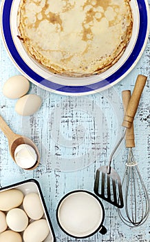 Cooking pancakes. Ingredients, crockery and kitchenware for pancakes