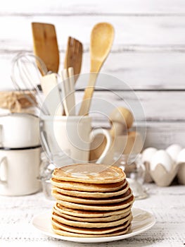 Cooking pancakes. Ingredients, crockery and kitchenware for pancakes