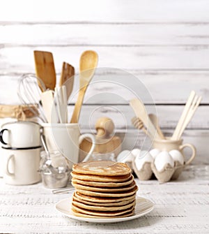 Cooking pancakes. Ingredients, crockery and kitchenware for pancakes