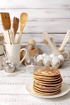 Cooking pancakes. Ingredients, crockery and kitchenware for pancakes