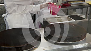 cooking of pancakes and traditional russian blini in fast-food cafe or russian restaurant, closeup