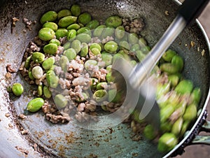 Cooking Parkia speciosa with pork Thai food.