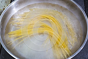 Cooking pasta in a pan.