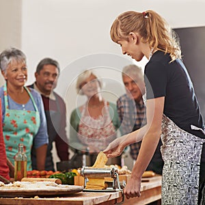 Cooking, pasta and senior people with instructor in kitchen learning recipe for cuisine, culinary and chef skills