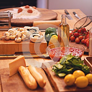 Cooking, pasta and vegetables in kitchen on table for meal prep for dinner, supper and lunch in home. Recipe, food and