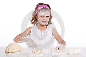 cooking and people concept - girl smiling chef with kitchen utensils,  on a white background.