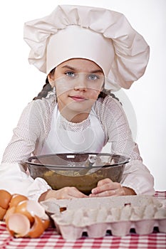 Cooking and people concept - smiling little girl in cook hat