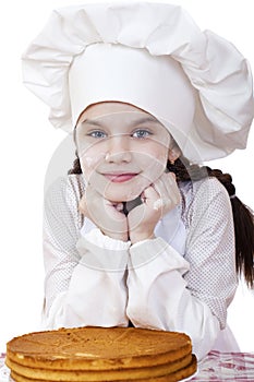 Cooking and people concept - smiling little girl in cook hat