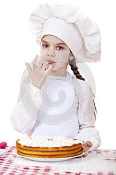 Cooking and people concept - smiling little girl in cook hat