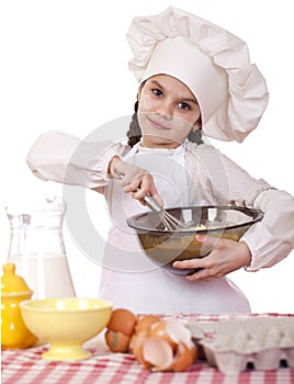 Cooking and people concept - smiling little girl in cook hat